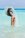 147856913-young-woman-in-bikini-make-water-splash-and-having-fun.jpg