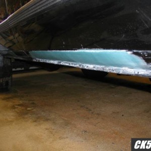 filled, not with bondo, thats long hair fiberglass! it wont rust there agai