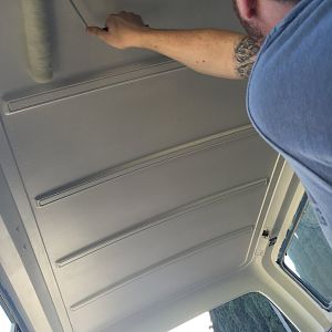 Painting the roof with white semi-gloss house paint