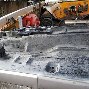 Hood pin bracket passenger side