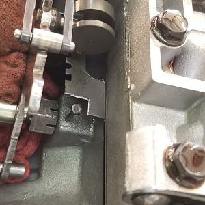 Notching plate to remove pin