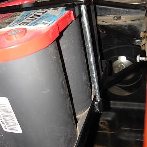 Battery hold down