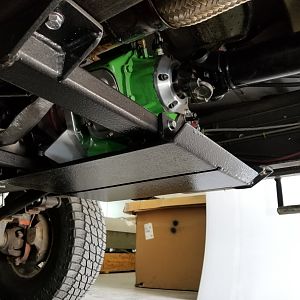 Skid plate & billet output retainer