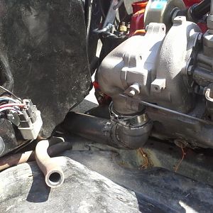 Turbo down pipe is kinda cobbled.  I rebuilt it later. a hump in the floor i made later gave way more room