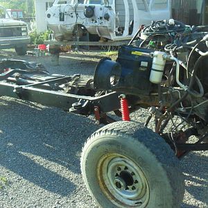 I built a front crossmember with rad support mount and extended spring hangars for the 52" springs I used up front