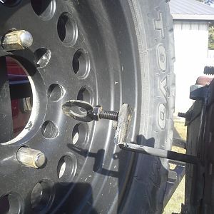 Couple nuts to hold on the spare