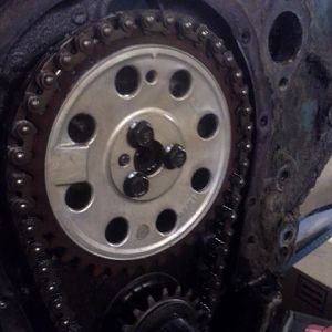 It still had the original nylon timing chain cam gear, So we changed that out to a double roller set