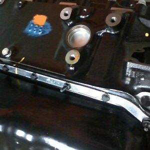 Factory oil pan bolt load spreader
