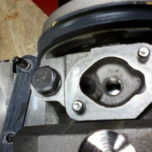 L31 main cap with oil passage radius cut into it