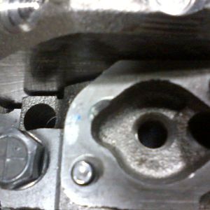 L31 main cap with oil passage radius cut into it