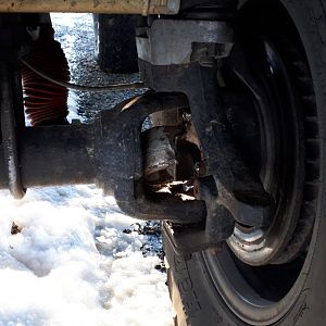 Only 37s but chained up and ox locker engaged. It broke...mabey a flaw in the axle or u joint. I dont know