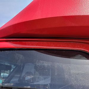 Top resting on cab roof.