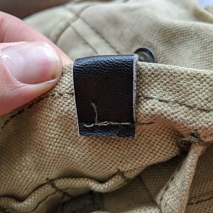Standard pouch retainer loop back
