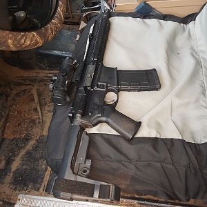 AR pistol on seat for scale