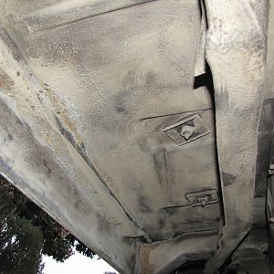 under cab to rear