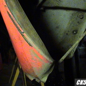 bent quarter panel closeup