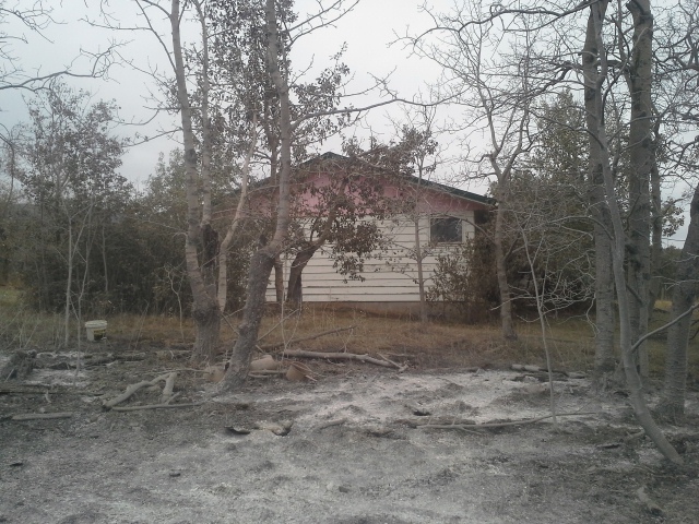 85GMCJD I was forced to leave as the fire burned through, but first I propped the fire hose aimed at the house, pump wide open.  It saved the house