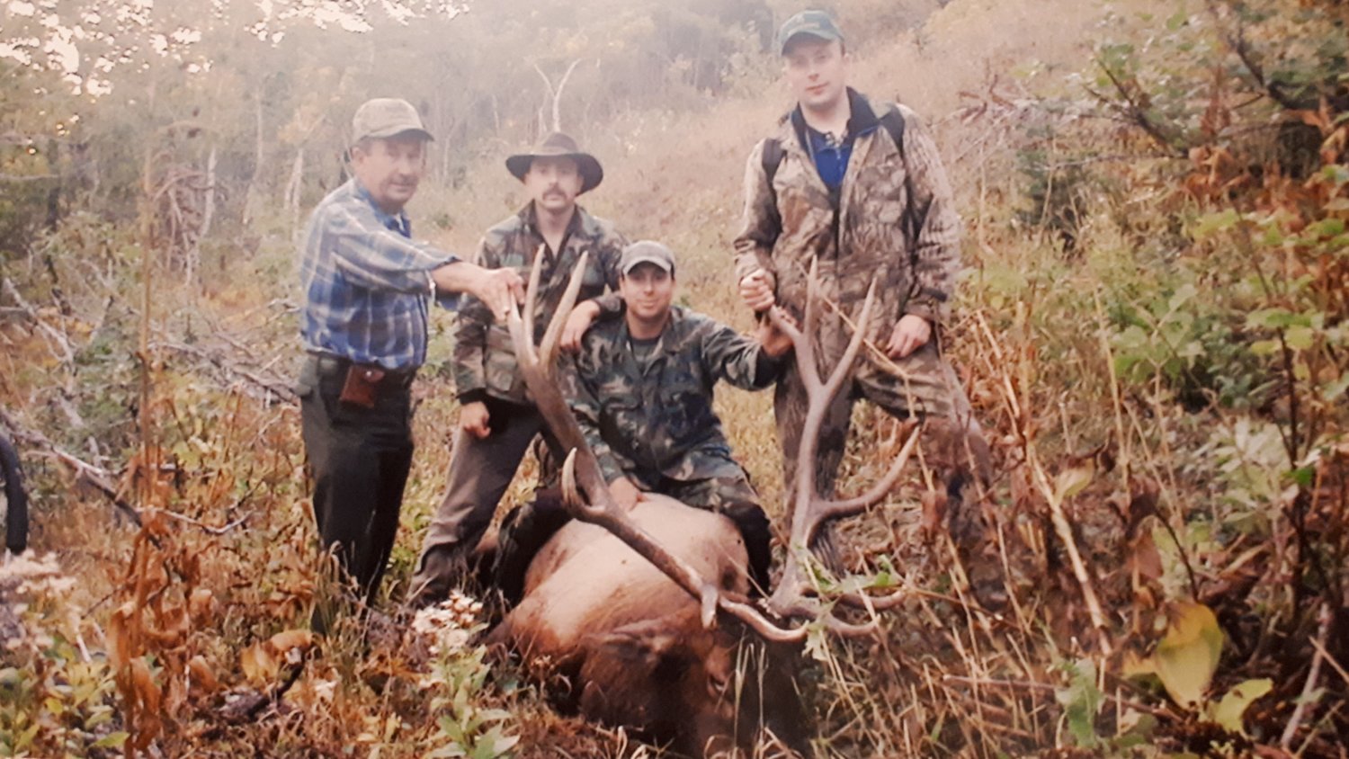 A good bull Dad shot. Dad, Myself and my two brothers Bruce and Shane.  There were 15 legal bulls with a few herds.  I shot one right after this pic.