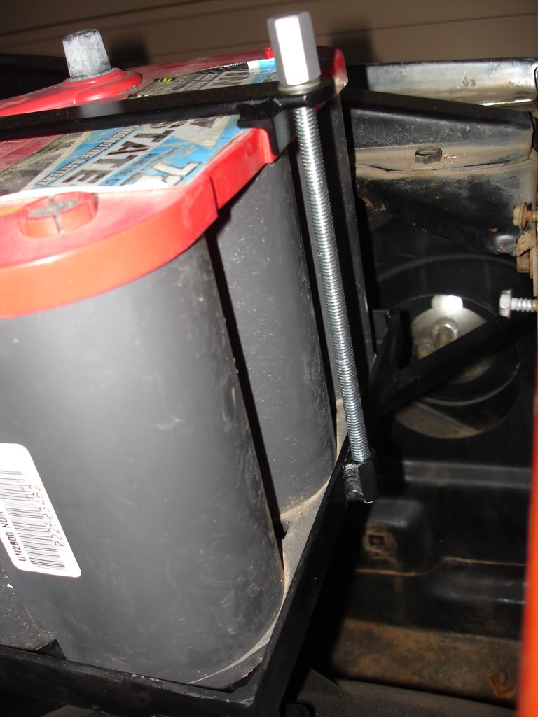 Battery hold down