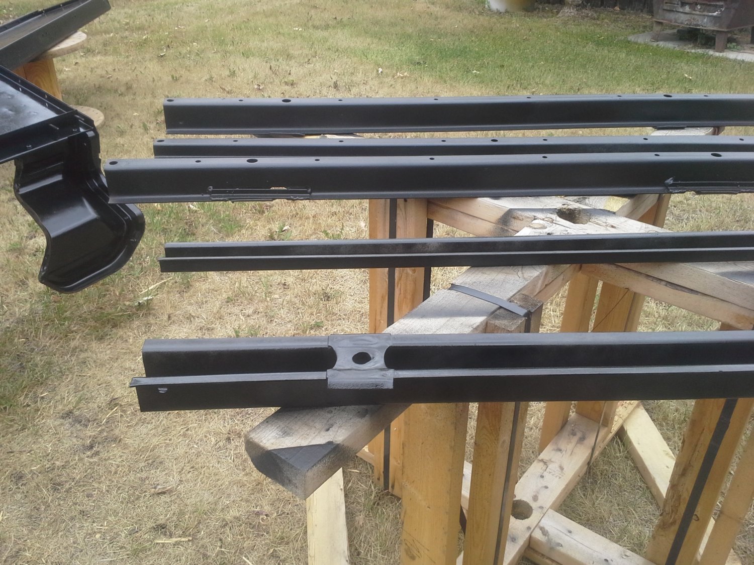 Because it had been a wood floor.  1" oak, and we used 3/16 steel for the floor, we needed a spacer between floor and braces