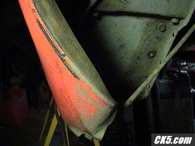 bent quarter panel closeup