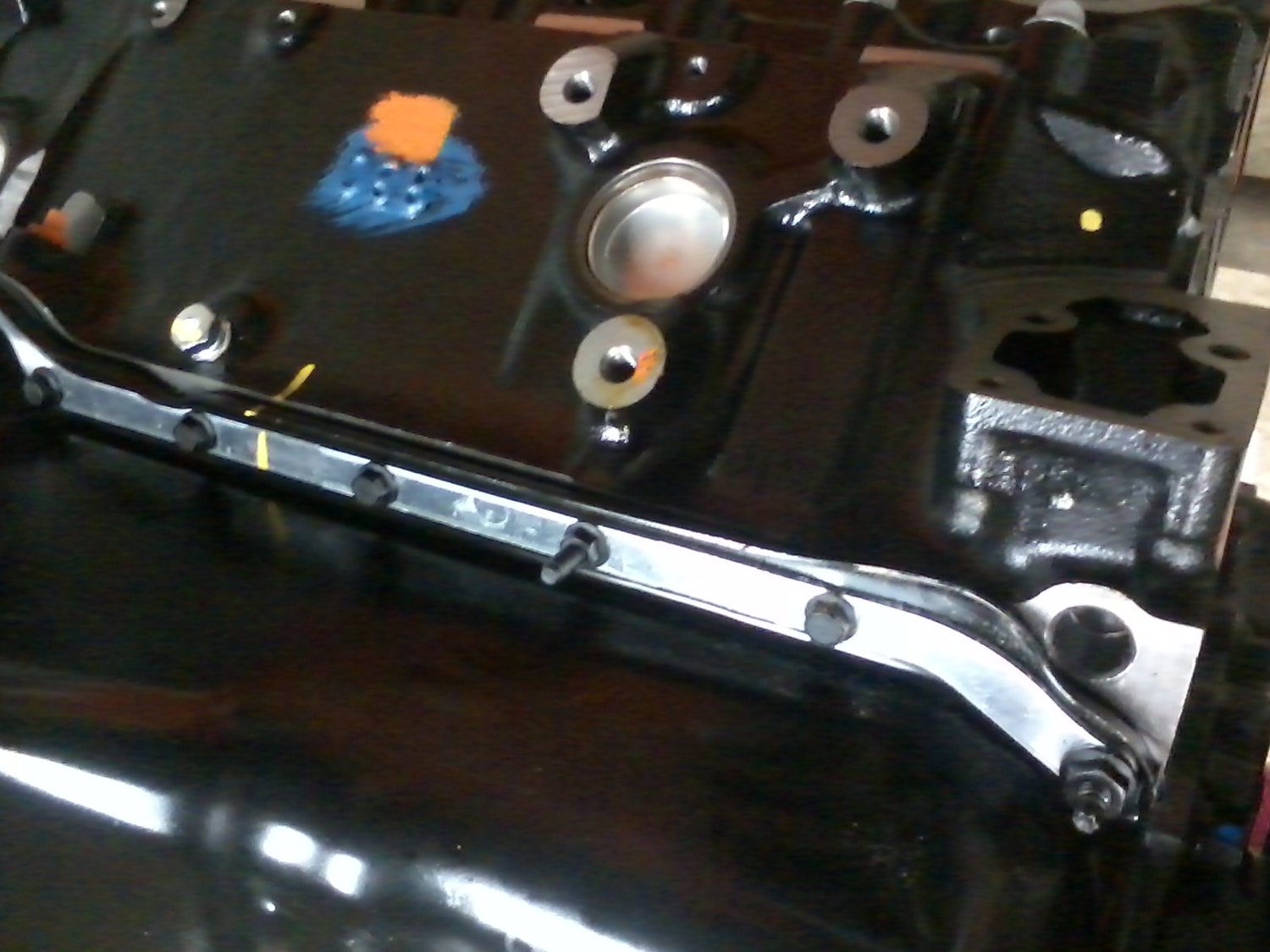 Factory oil pan bolt load spreader