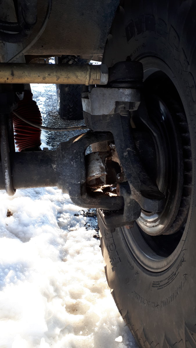 Only 37s but chained up and ox locker engaged. It broke...mabey a flaw in the axle or u joint. I dont know