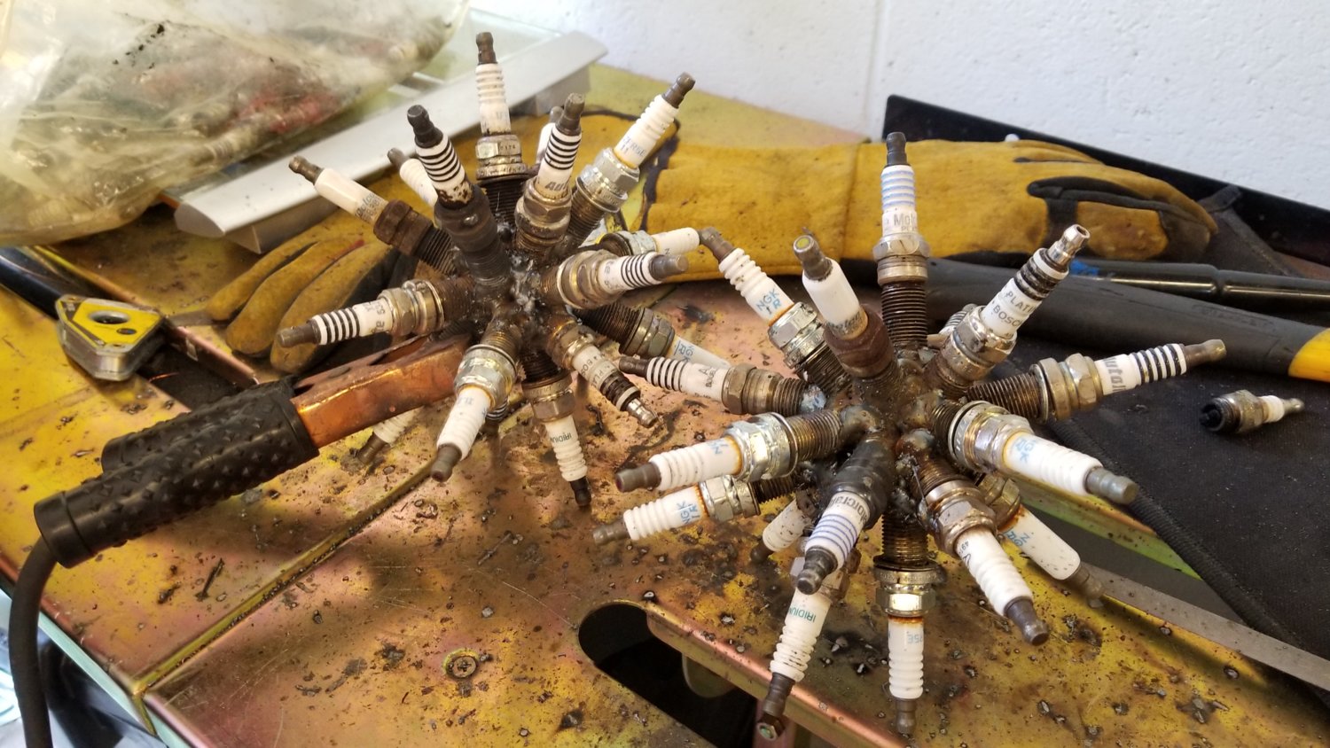 Spark plug balls
